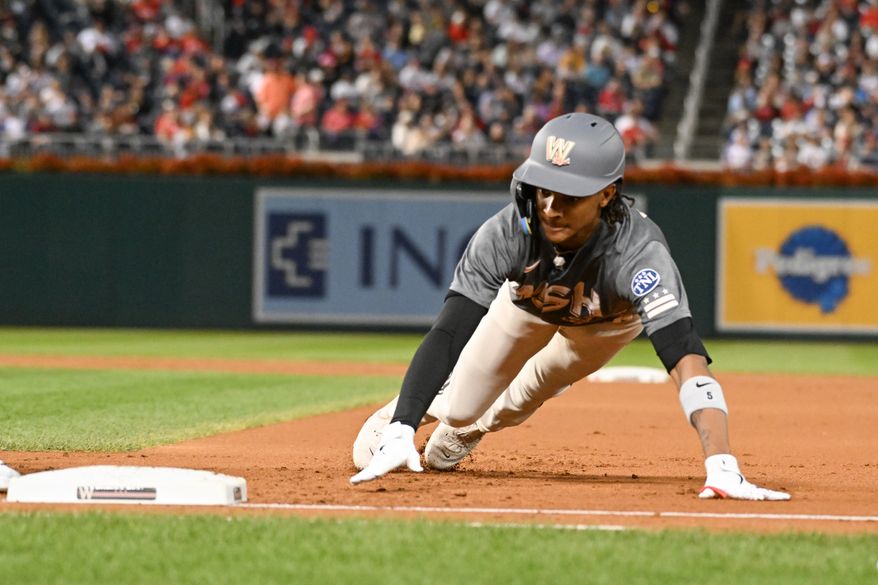 Washington Nationals shortstop C.J. Abrams (5) diving back to first on an attempted pick off play during the first inning of an MLB game against the Atlanta Braves at Nationals Park in Washington D.C., September 22, 2023. (Photo by Billy Sabatini/All-Pro Reels)