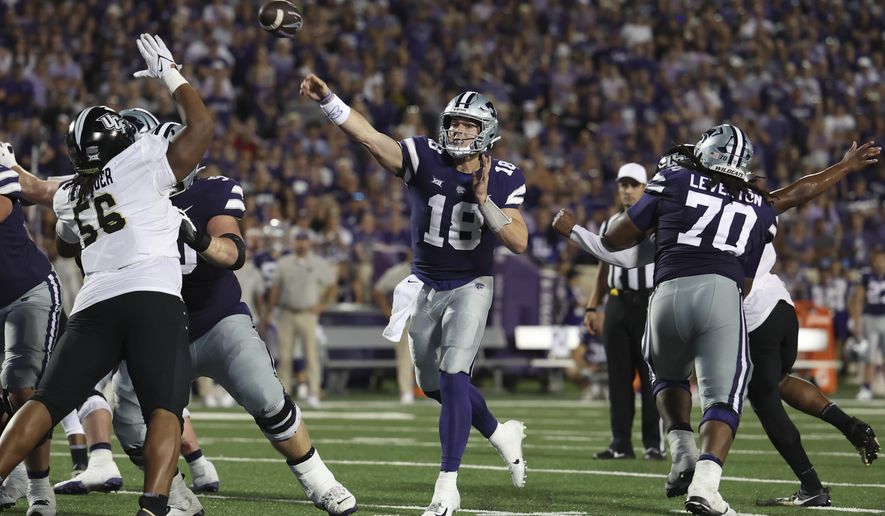 Kansas State quarterback Will Howard (18) throws a pass during the first half of an NCAA college football game against Central Florida on Saturday, Sept. 23, 2023, in Manhattan, Kan. (AP Photo/Travis Heying)