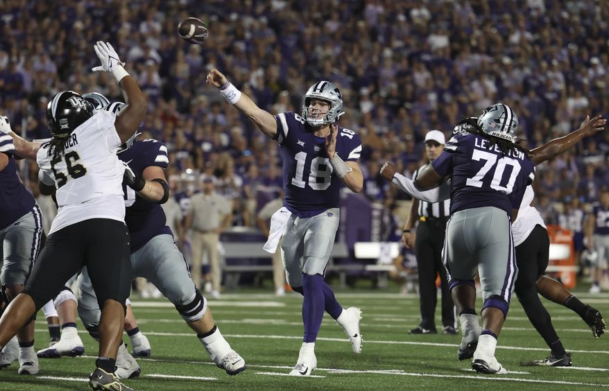 Kansas State quarterback Will Howard (18) throws a pass during the first half of an NCAA college football game against Central Florida on Saturday, Sept. 23, 2023, in Manhattan, Kan. (AP Photo/Travis Heying)