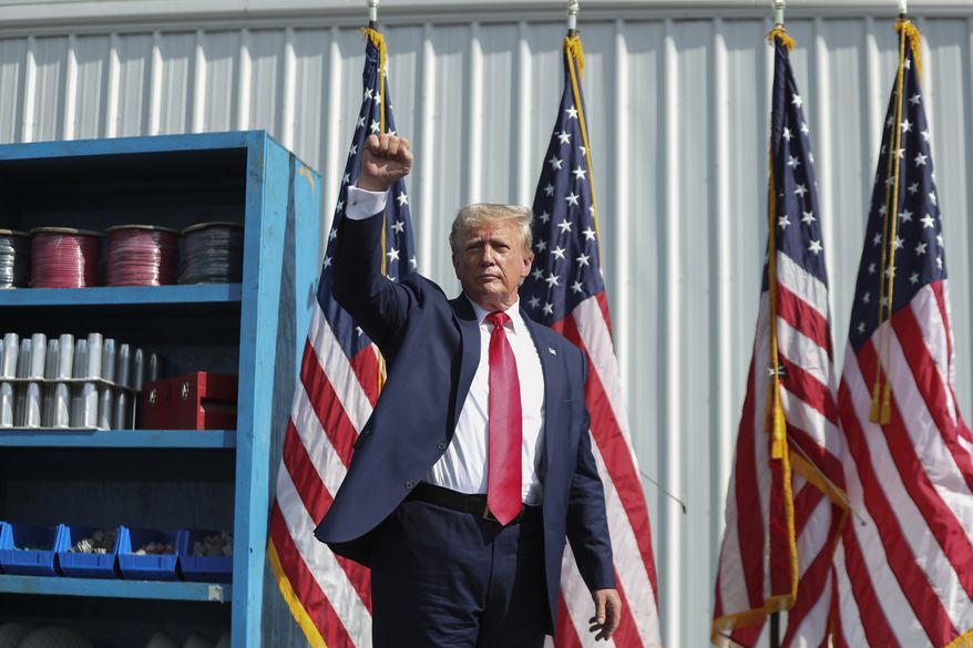 Former President Donald Trump ends his remarks and holds up his fist at a rally in Summerville, S.C., Monday, Sept. 25, 2023. (AP Photo/Artie Walker Jr.)