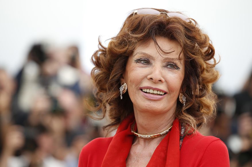 Italian actress Sophia Loren smiles during a photo call for "Human Voice," (Voce Umana) at the 67th International Film Festival, Cannes, southern France, on May 21, 2014. Film legend Sophia Loren is recovering from successful surgery for a leg fracture after she fell in her Switzerland home, an agent for the 89-year-old Italian actor said Monday, Sept. 25, 2023. (AP Photo/Alastair Grant, File)