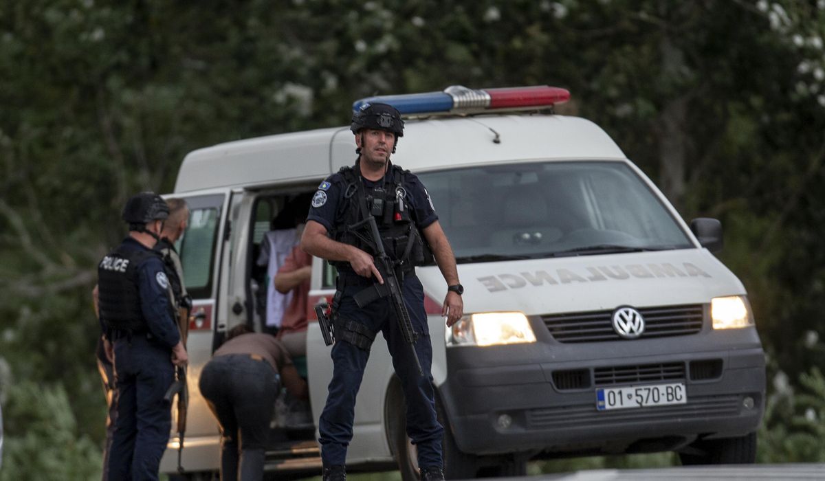 NextImg:Kosovo mourns a slain police officer, some Serb gunmen remain at large after a siege at a monastery