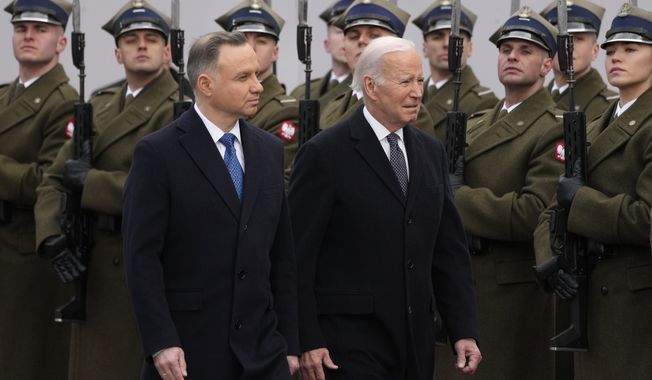 Polish President Andrzej Duda, left, welcomes President Joe Biden at the Presidential Palace in Warsaw, Ukraine, Tuesday, Feb. 21, 2023. The Biden administration announced Monday, Sept. 25, that it is offering a $2 billion loan to Poland, which has been a hub for weapons going into Ukraine, to support the ally&#x27;s defense modernization. (AP Photo/Czarek Sokolowski, File)