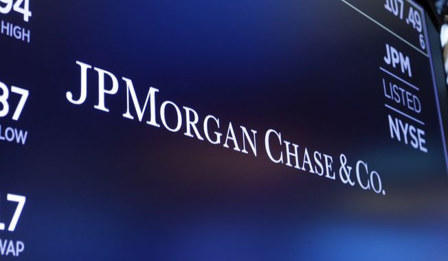 The logo for JPMorgan Chase &amp; Co. appears above a trading post on the floor of the New York Stock Exchange in New York, Aug. 16, 2019. (AP Photo/Richard Drew, File)