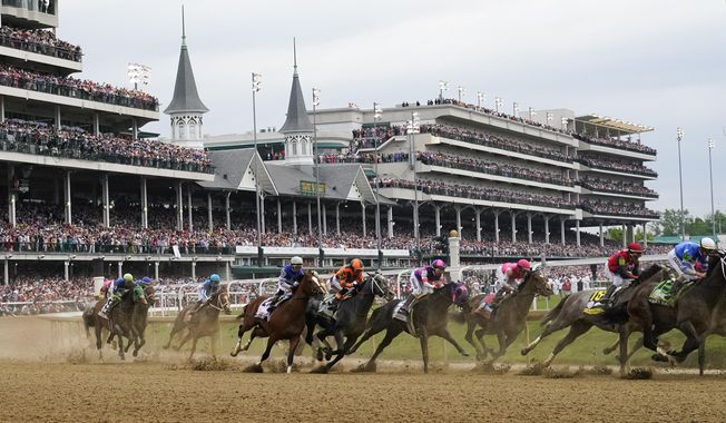 Javier Castellano, atop Mage, third from left, is seen with others behind the pack as they make the first turn while competing in the 149th running of the Kentucky Derby horse race at Churchill Downs Saturday, May 6, 2023, in Louisville, Ky. Horse racing groups are backing legislation in the U.S. House of Representatives that they hope will replace the federal organization overseeing the sport for just a year. (AP Photo/Julio Cortez, File)