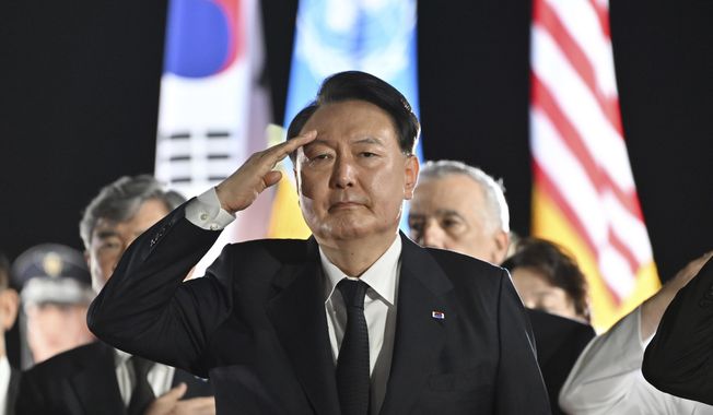 South Korean President Yoon Suk Yeol salutes during a repatriation ceremony to receive the remains of South Korean soldiers killed in the 1950-53 Korean War, at Seoul Air Base in Seongnam, South Korea, on July 26, 2023. Yoon vowed immediate retaliation against any potential provocation by North Korea in his Armed Forces Day speech Tuesday, Sept. 26, as thousands of troops were set to march through Seoul, the capital, in the first such military parade in 10 years. (Jung Yeon-Je/Pool Photo via AP, File)