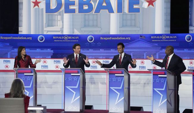 From left to right, former U.N. Ambassador Nikki Haley, Florida Gov. Ron DeSantis, businessman Vivek Ramaswamy and Sen. Tim Scott, R-S.C., argue a point during a Republican presidential primary debate hosted by FOX Business Network and Univision, Wednesday, Sept. 27, 2023, at the Ronald Reagan Presidential Library in Simi Valley, Calif. (AP Photo/Mark J. Terrill)