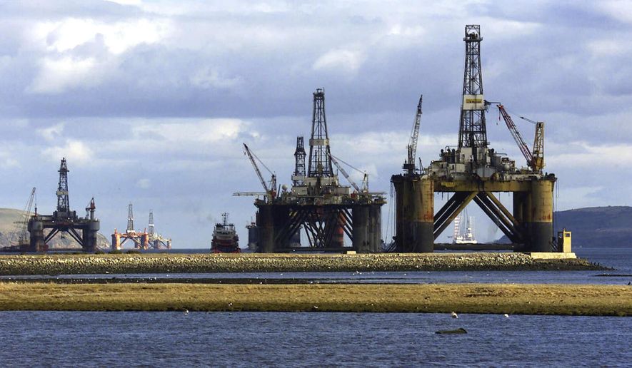 North sea oil exploration platforms lie in the Cromerty Firth in northern Scotland on March 2, 2003. British regulators on Wednesday, Sept. 27, 2023, approved new oil and gas drilling in the North Sea, a move environmentalists say will hurt the country’s attempt to meet its climate goals. (AP Photo/Martin Cleaver)