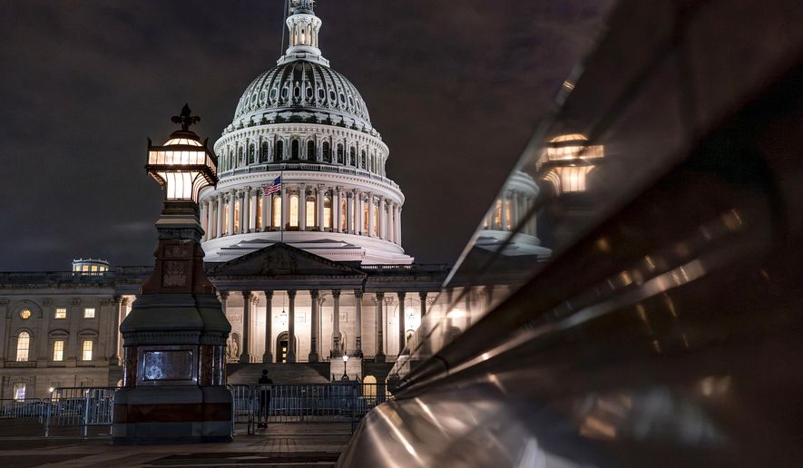 The Capitol is seen late Tuesday night, Sept. 26, 2023, in Washington, as lawmakers work to advance appropriations bills on the House floor. The Republican-controlled House and the Democrat-controlled Senate are starkly divided over very different paths to preventing a federal shutdown. (AP Photo/J. Scott Applewhite)