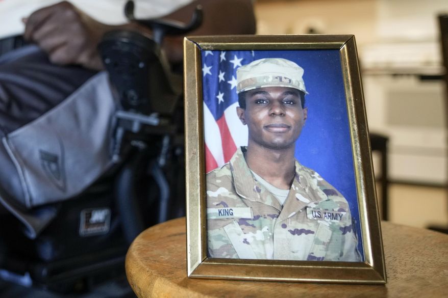 A portrait of American soldier Travis King is displayed as his grandfather, Carl Gates, talks about his grandson on July 19, 2023, in Kenosha, Wis. North Korea says on Wednesday, Sept. 27, it has decided to expel a U.S. soldier who crossed into the country through the heavily armed inter-Korean border in July. (AP Photo/Morry Gash, File)