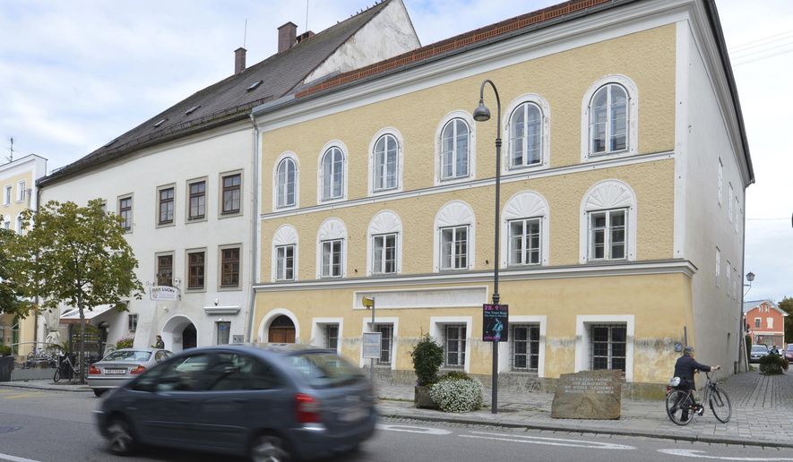 An exterior view of Adolf Hitler's birth house, front, in Braunau am Inn, Austria, on Sept. 27, 2012. Work started Monday Oct. 2, 2023 on turning the house where Adolf Hitler was born in 1889 into a police station, a project meant to make it unattractive as a site of pilgrimage for people who glorify the Nazi dictator. (AP Photo / Kerstin Joensson, File)