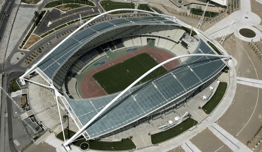 The Olympic stadium is seen from above in Athens, Greece on April 19, 2006. Government officials say Monday, Oct. 2, 2023 a new inspection has been ordered at a stadium that hosted the Athens Olympics in 2004 after rust was found along the iconic arched roof, forcing the site to close. The arched roof structures were designed by renowned Spanish architect Santiago Calatrava for the 2004 Athens Olympics. (AP Photo/Thanassis Stavrakis, File)