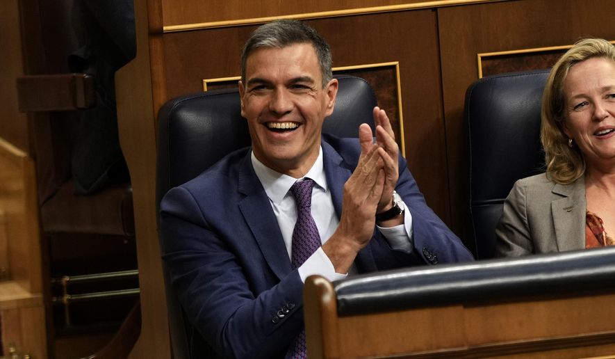 Acting Prime Minister Pedro Sanchez applauds at the Spanish Parliament's lower house in Madrid, Spain on Friday, Sept. 29, 2023. The leader of Spain's conservatives on Friday failed for the second time in three days to get parliamentary support for his bid to become prime minister following his party's victory in a national election. (AP Photo/Bernat Armangue)