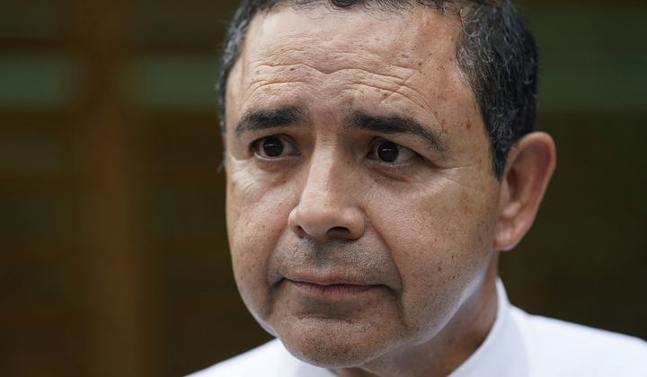U.S. Rep. Henry Cuellar, D-Texas, talks to a member of the media during a campaign event in San Antonio on May 4, 2022. (AP Photo/Eric Gay) **FILE**