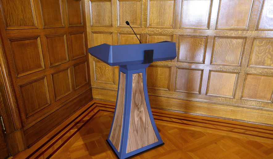 The $19,029.25 lectern purchased by the Sanders administration in June, sits in a corner in the Governor's Conference Room at the state Capitol in Little Rock, Ark., Tuesday, Sept. 26, 2023. (Thomas Metthe/Arkansas Democrat-Gazette via AP)