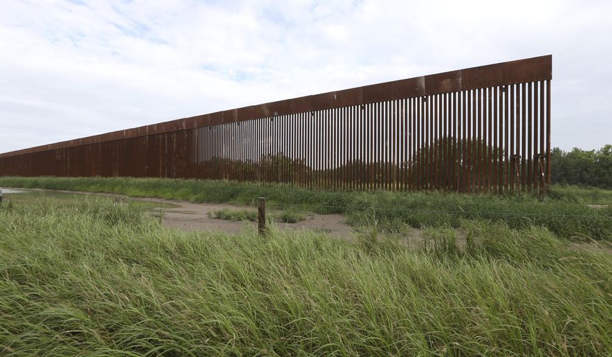 A border wall section stands on July 14, 2021, near La Grulla, Texas, in Starr County. On Wednesday, Oct. 4, 2023, the Biden administration announced that they waived 26 federal laws in South Texas to allow border wall construction, marking the administration’s first use of a sweeping executive power employed often during the Trump presidency. The Department of Homeland Security posted the announcement with few details outlining the construction in Starr County, Texas. (Delcia Lopez/The Monitor via AP, File)