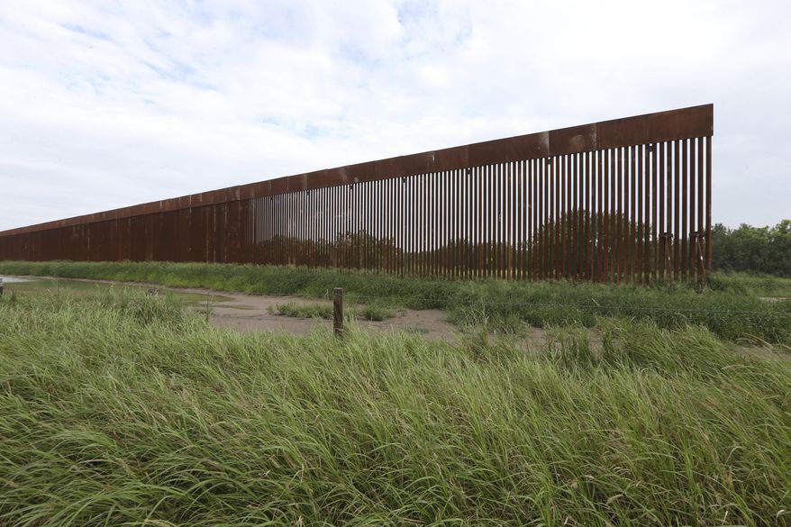 A border wall section stands on July 14, 2021, near La Grulla, Texas, in Starr County. On Wednesday, Oct. 4, 2023, the Biden administration announced that they waived 26 federal laws in South Texas to allow border wall construction, marking the administration’s first use of a sweeping executive power employed often during the Trump presidency. The Department of Homeland Security posted the announcement with few details outlining the construction in Starr County, Texas. (Delcia Lopez/The Monitor via AP, File)