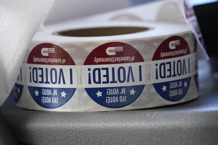 A roll of "I Voted!" stickers are shown, Oct. 6, 2020, at the Miami-Dade County Elections Department in Doral, Fla. A Florida man has been arrested on forgery and fraud charges after authorities say he cast a ballot for his deceased father in the 2020 election. (AP Photo/Wilfredo Lee, File)