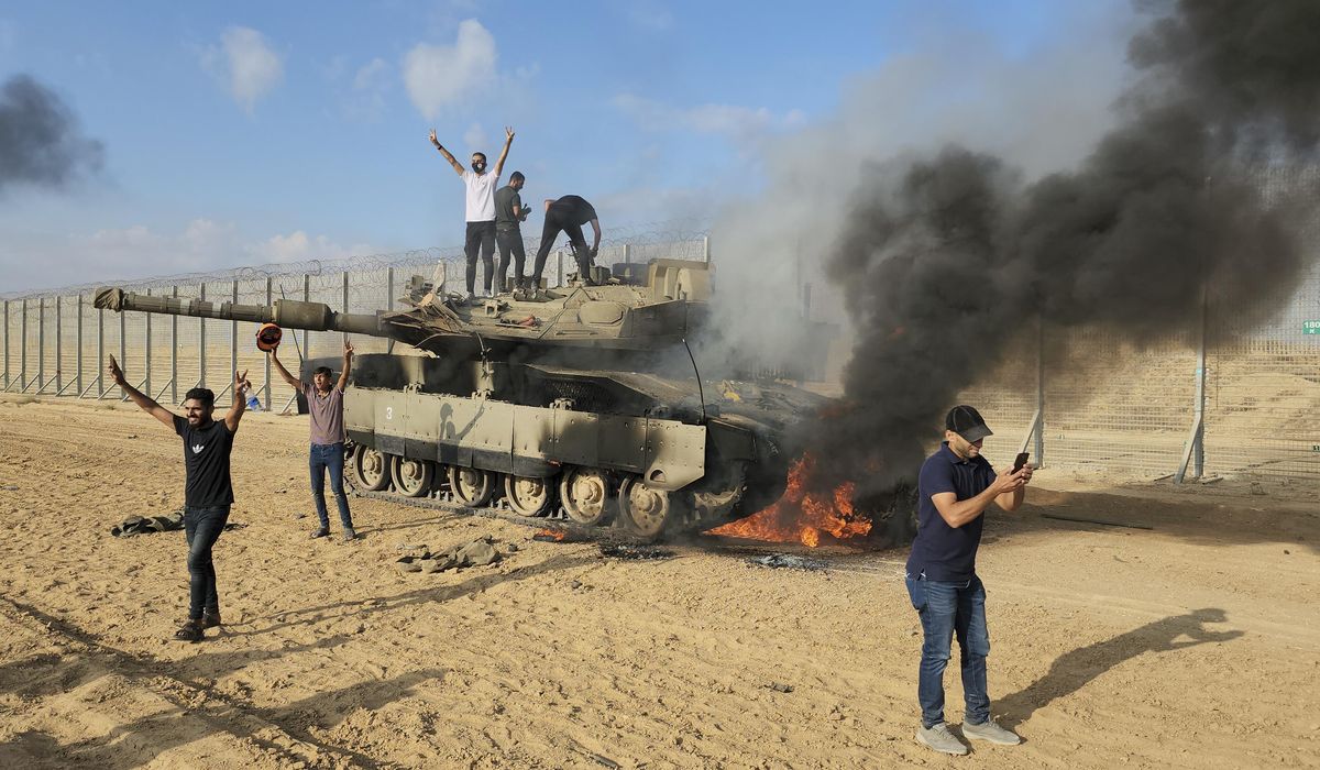 NextImg:AP, Reuters photographers were on scene for Hamas attack, spurring ethical questions