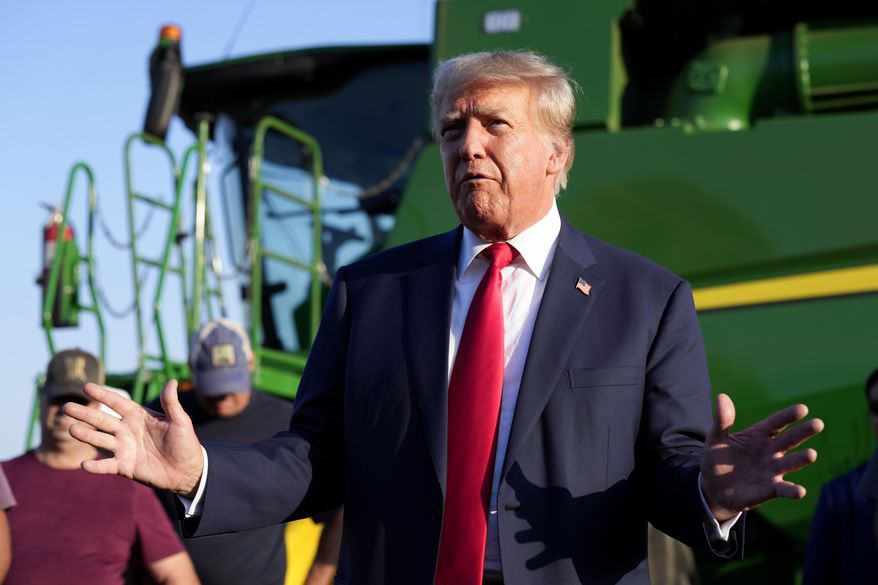 Former President Donald Trump speaks to reporters during a visit to the Vande Voort family farm, Sunday, Oct. 1, 2023, in Leighton, Iowa. Trump continues his autumn push in Iowa with campaign events in two cities. Trump’s Saturday afternoon stops in Waterloo and Cedar Rapids are his third and fourth in a little more than two weeks. (AP Photo/Charlie Neibergall, File)