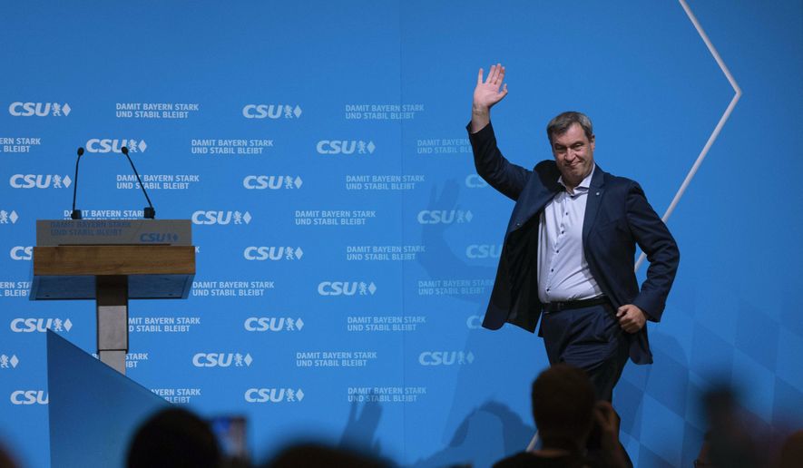 Top candidate and leader of Christian Social Union party, CSU, Markus Soeder, arrives the podium for a final election campaign in Munich, Germany, Friday, Oct. 6, 2023, ahead of Bavaria's state election on Oct. 8, 2023. Two German states hold elections on Sunday, Oct. 8, 2023 at the half-way mark of Chancellor Olaf Scholz's unpopular national government, with polls showing the center-right opposition well ahead and Germany's interior minister facing long odds in a bid to become governor of her home region. (AP Photo/Matthias Schrader, File)