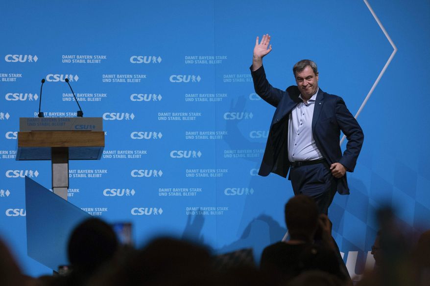 Top candidate and leader of Christian Social Union party, CSU, Markus Soeder, arrives the podium for a final election campaign in Munich, Germany, Friday, Oct. 6, 2023, ahead of Bavaria's state election on Oct. 8, 2023. Two German states hold elections on Sunday, Oct. 8, 2023 at the half-way mark of Chancellor Olaf Scholz's unpopular national government, with polls showing the center-right opposition well ahead and Germany's interior minister facing long odds in a bid to become governor of her home region. (AP Photo/Matthias Schrader, File)