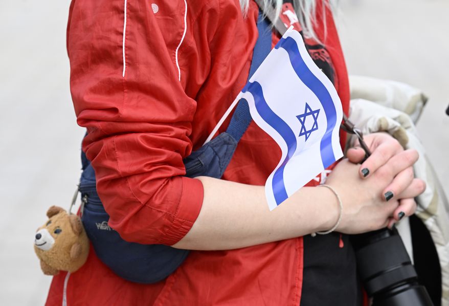 A citizen takes part in a solidarity rally for Israel in front of the Landtag in Duesseldorf, Germany, Sunday, Oct. 8, 2023. (Roberto Pfeil/dpa via AP)