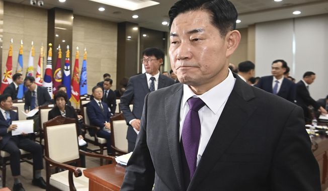 South Korean Defense Minister Shin Won-sik leaves after attending a parliamentary inspection of his agency at the National Defense committee of the National Assembly in Seoul, South Korea, Tuesday, Oct. 10, 2023. Shin said Tuesday he would push to suspend a 2018 inter-Korean military agreement in order to resume frontline surveillance on rival North Korea, as the surprise attack on Israel by Hamas militants raised concerns in South Korea about similar assaults by the North. (Yonhap via AP)