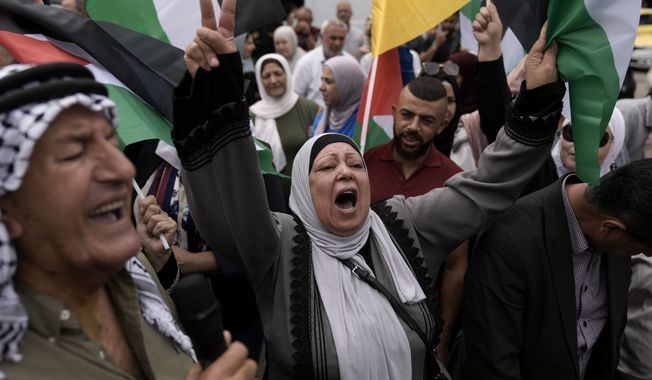 Palestinians attend a rally in support of Hamas and the Gaza Strip in the West Bank city of Nablus on Monday, Oct. 9, 2023. (AP Photo/Majdi Mohammed, File)