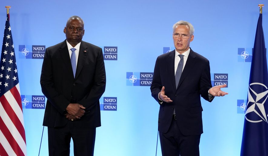 NATO Secretary General Jens Stoltenberg, right, and United States Secretary of Defense Lloyd Austin address a media conference on the sidelines of a meeting of NATO defense ministers at NATO headquarters in Brussels, Thursday, Oct. 12, 2023. (AP Photo/Virginia Mayo)
