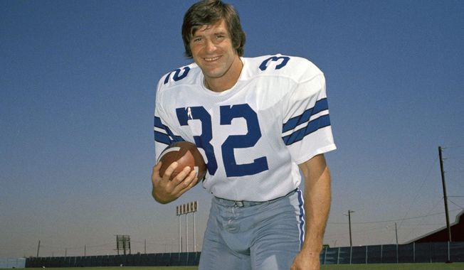 FILE - Walt Garrison, running back for the Dallas Cowboys, is shown in this 1974 photo. Walt Garrison, who led the Big 8 in rushing as an Oklahoma State Cowboy, won a Super Bowl with the Dallas Cowboys, and in the NFL offseason competed as a rodeo cowboy, has died. He was 79. The NFL team said in a story posted on its website Thursday, Oct. 12, 2023, that Garrison died overnight. (AP Photo/File)