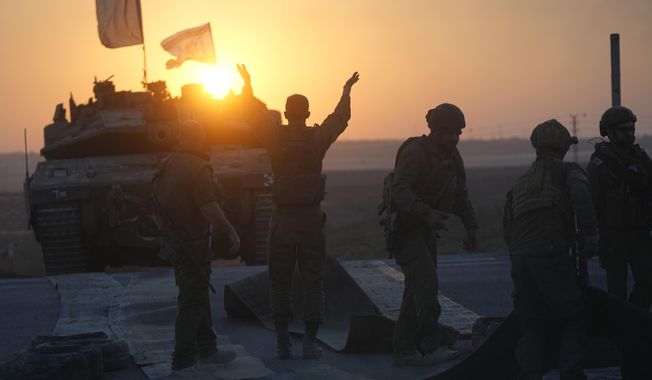Israeli tanks head towards the Gaza Strip border in southern Israel on Thursday, Oct.12, 2023. (AP Photo/Ohad Zwigenberg)