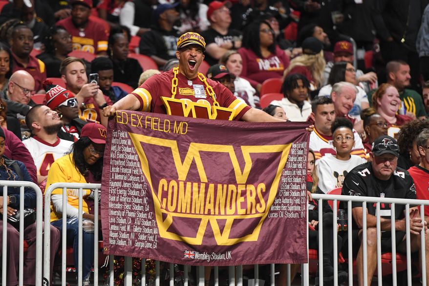 A Washington Commanders fan in the stands during an NFL game against the Atlanta Falcons at Mercedes-Benz Stadium in Atlanta, GA, October 15, 2023. (Photo by Billy Sabatini)