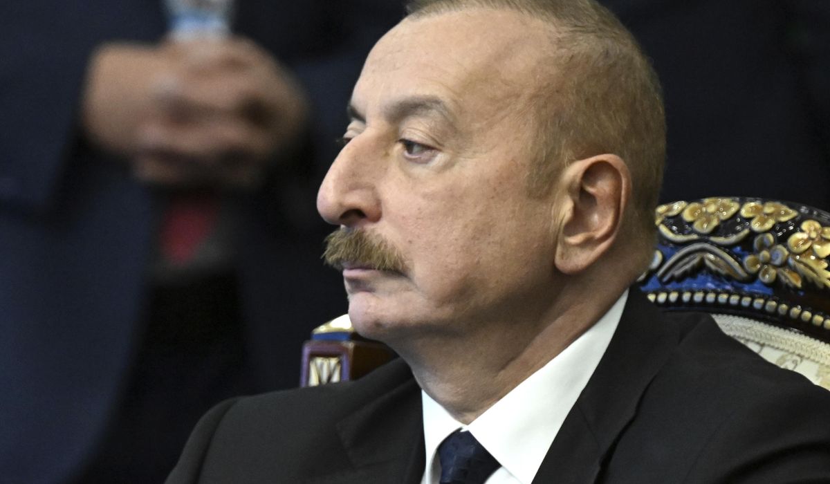 NextImg:Azerbaijan’s president raises the nation’s flag in a former breakaway region’s capital