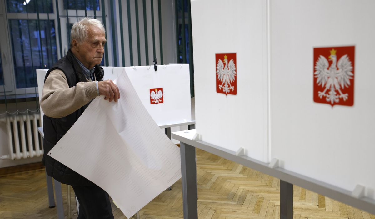 NextImg:Poles vote in a high-stakes election that will determine whether right-wing party stays in power