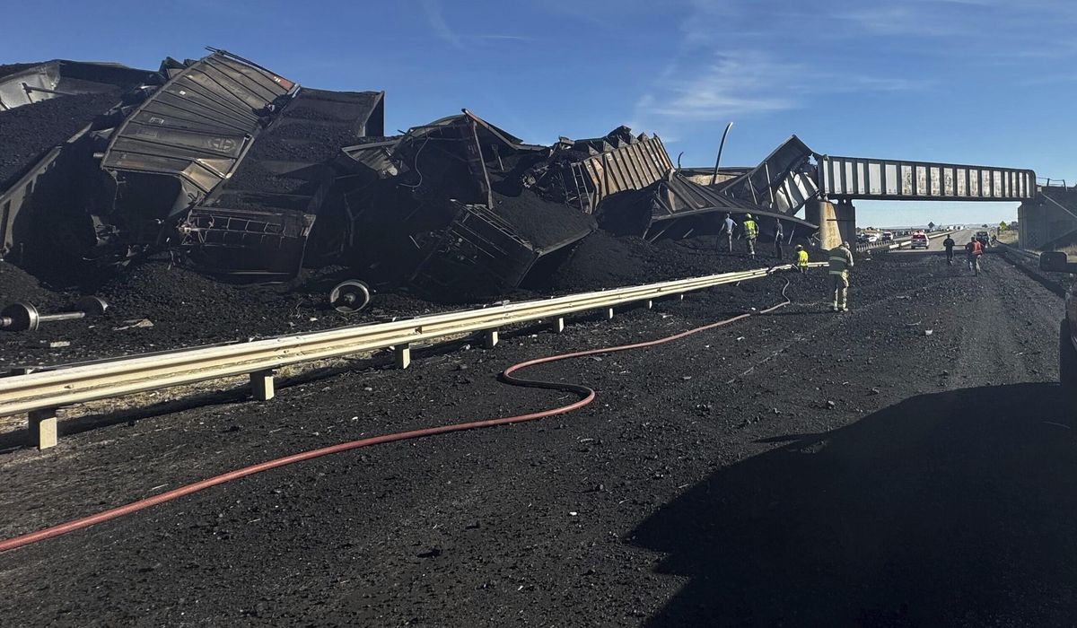 NextImg:Semitruck driver killed when Colorado train derails, spilling train cars and coal onto a highway