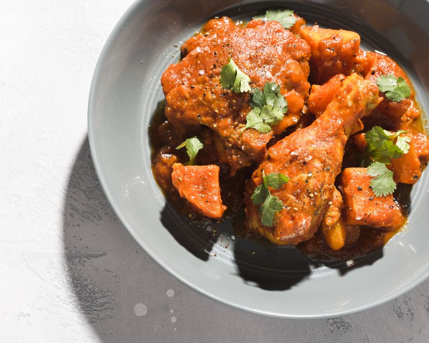This image released by Milk Street shows a recipe for red stew with chicken. (Milk Street via AP)