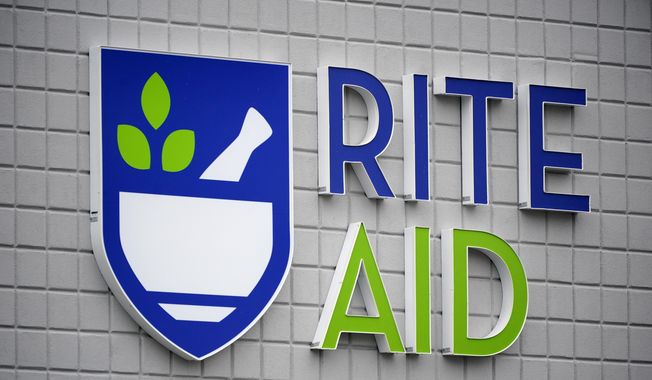 This photo shows a sign of Rite Aid on its store in Pittsburgh on Jan. 23, 2023. Rite Aid, a major U.S. pharmacy chain, said Sunday, Oct. 15, that it has filed for bankruptcy as part of its effort to restructure its finances. (AP Photo/Gene J. Puskar) **FILE**