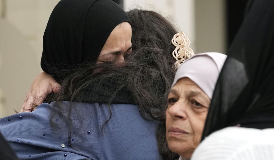 Muslim community members mourn the death of Wadea Al Fayoume at Mosque Foundation in Bridgeview, Ill., Monday, Oct. 16, 2023. An Illinois landlord accused of fatally stabbing the 6-year-old Muslim boy and seriously wounding his mother was charged with a hate crime after police and relatives said he singled out the victims because of their faith and as a response to the war between Israel and Hamas. (AP Photo/Nam Y. Huh)