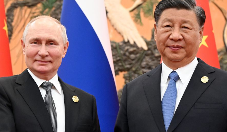 Chinese President Xi Jinping, right, and Russian President Vladimir Putin pose for a photo prior to their talks on the sidelines of the Belt and Road Forum in Beijing, China, on Wednesday, Oct. 18, 2023. (Sergei Guneyev, Sputnik, Kremlin Pool Photo via AP)