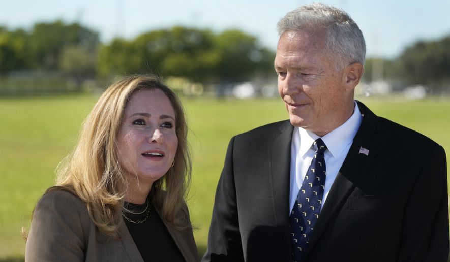 Former Rep. Debbie Mucarsel-Powell, D-Fla., left, speaks during a news conference alongside Navy Cmdr. (Ret.) Phil Ehr at the Memorial Cubano in Tamiami Park, Wednesday, Oct. 18, 2023, in Miami. Mucarsel-Powell, who is running for a Senate seat against Republican Rick Scott, endorsed Ehr for Congress. (AP Photo/Wilfredo Lee)