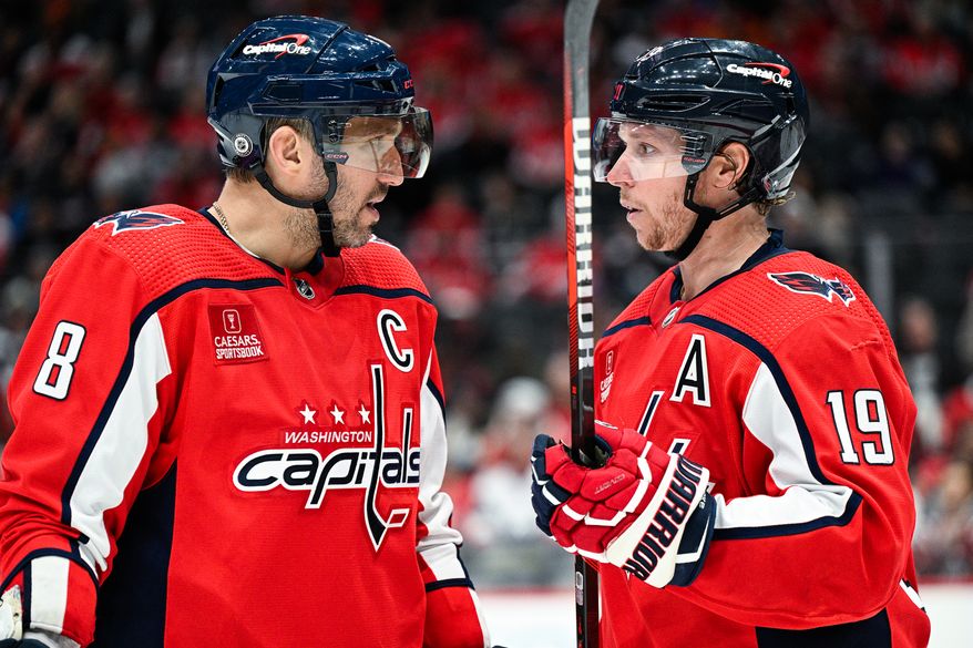 Washington Capitals left wing Alex Ovechkin (8) and center Nicklas Backstrom (19) talk strategy during a stoppage in play against the Calgary Flames at Capital One Arena, Washington, D.C., October 16, 2023. (Photo by Brian Murphy for the Washington Times)