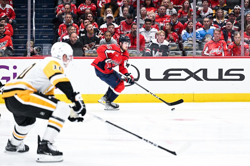 Washington Capitals defenseman Lucas Johansen (46) carries the puck up the ice against the Pittsburgh Penguins at Capital One Arena, Washington, D.C., October 13, 2023. (Photo by Brian Murphy for the Washington Times)