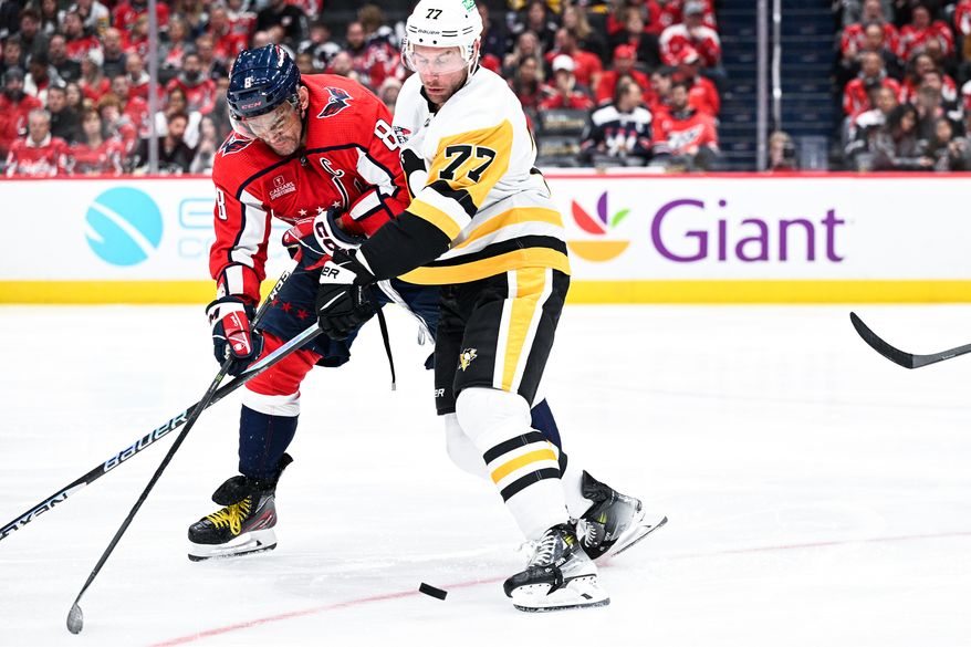 Washington Capitals left wing Alex Ovechkin (8) fights for a loose puck against the Pittsburgh Penguins at Capital One Arena, Washington, D.C., October 13, 2023. (Photo by Brian Murphy for the Washington Times)