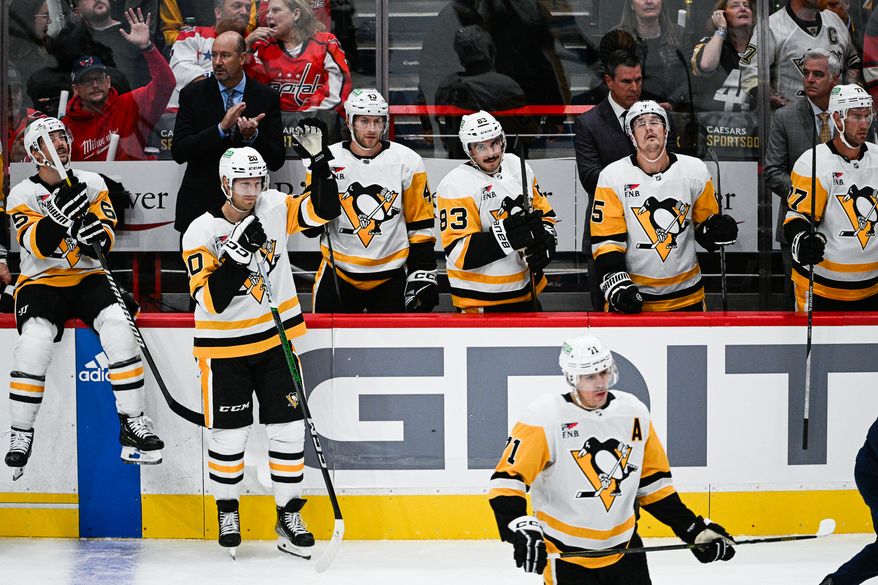 Pittsburgh Penguins center Lars Eller (20) waves to the crowd as a video tribute plays in honor of the former Washington Capitals player at Capital One Arena, Washington, D.C., October 13, 2023. (Photo by Brian Murphy for the Washington Times)