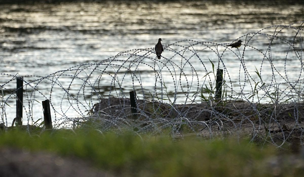 NextImg:Texas sues Biden administration, seeking to stop federal agents from cutting razor wire on border