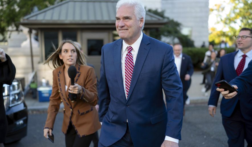 House Majority Whip Rep. Tom Emmer, R-Minn., followed by reporters, leaves the Republican caucus meeting at the Capitol in Washington, Tuesday, Oct. 24, 2023, after withdrawing as Republican nominee for House speaker, becoming the third candidate to fall short. (AP Photo/Jose Luis Magana)