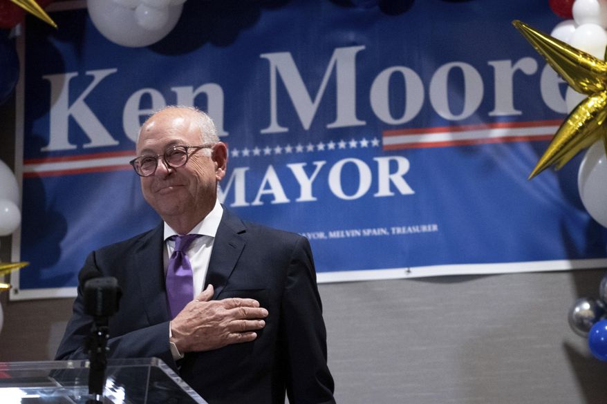 Franklin Mayor Ken Moore accepts the applause of his supporters after securing re-election at the Election Night watch party at the Harpeth Hotel in Franklin, Tenn., Tuesday, Oct. 24, 2023. Voters in a Tennessee city have rejected a far-right candidate for mayor who drew national scrutiny over the support she received from white supremacists. Gabrielle Hanson lost the race against Moore on Tuesday. (Denny Simmons/Evansville Courier & Press via AP)