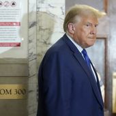 Former President Donald Trump returns to the courtroom after a break in his civil business fraud trial at New York Supreme Court, Wednesday, Oct. 25, 2023, in New York. The judge in Donald Trump&#x27;s civil fraud trial has fined the former president $10,000. The judge says Trump violated a limited gag order barring personal attacks on court staffers.(AP Photo/Seth Wenig)