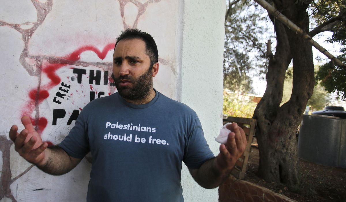 NextImg:Palestinian activist is expelled by Israeli forces from his home in a volatile West Bank city